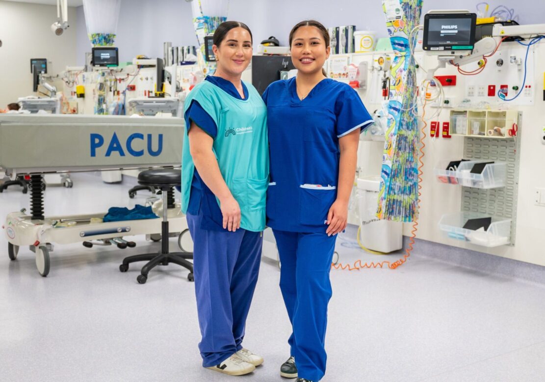 Two volunteers stand in the Paediatric Intensive Care Unit at Queensland Children's Hospital