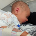 A small baby receives gene therapy