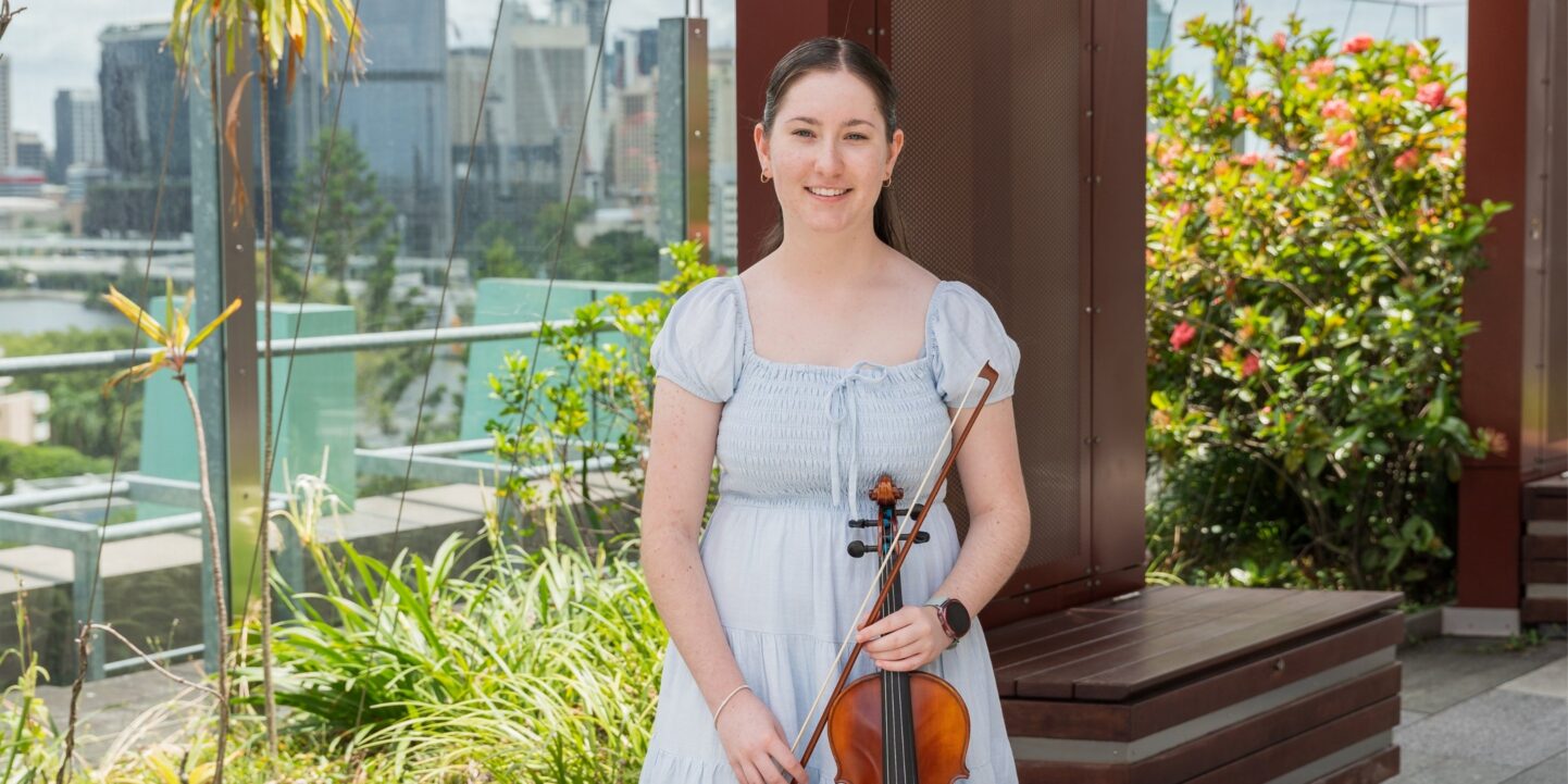 Lucy, 14, with her violin in the Queensland Children's Hospital garden