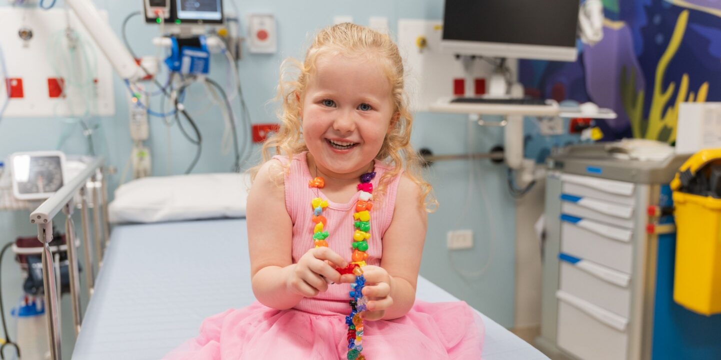 Nevaeh, 4, in a treatment room wearing her bravery beads