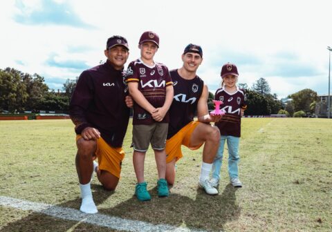 Sienna and her brother, Byron, pose with Broncos players