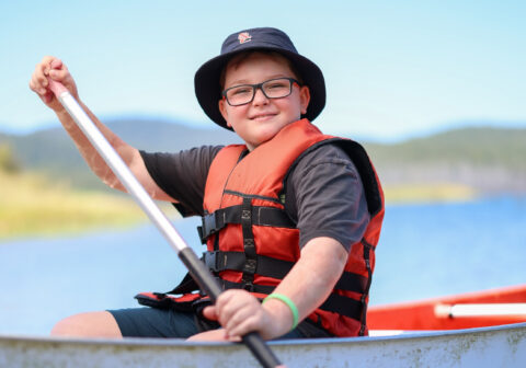 Charlie in a kayak at Camp Oz